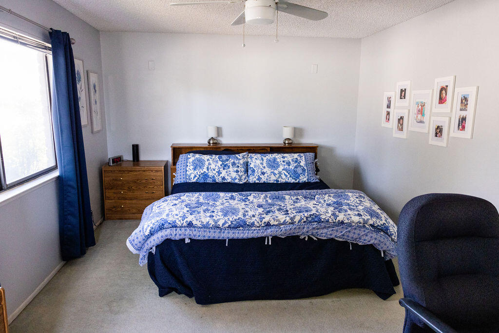 812 West Vicki Avenue Ridgecrest, CA 93555 - Photo 21 of 68 a bedroom with a bed and a window