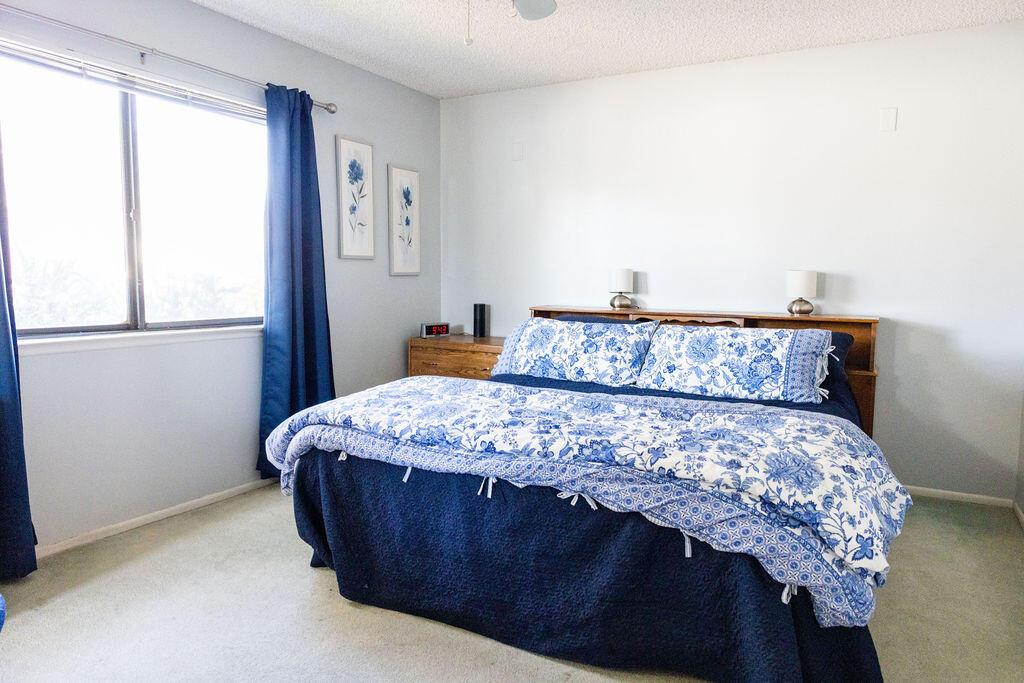 812 West Vicki Avenue Ridgecrest, CA 93555 - Photo 22 of 68 a bedroom with a large bed and a window