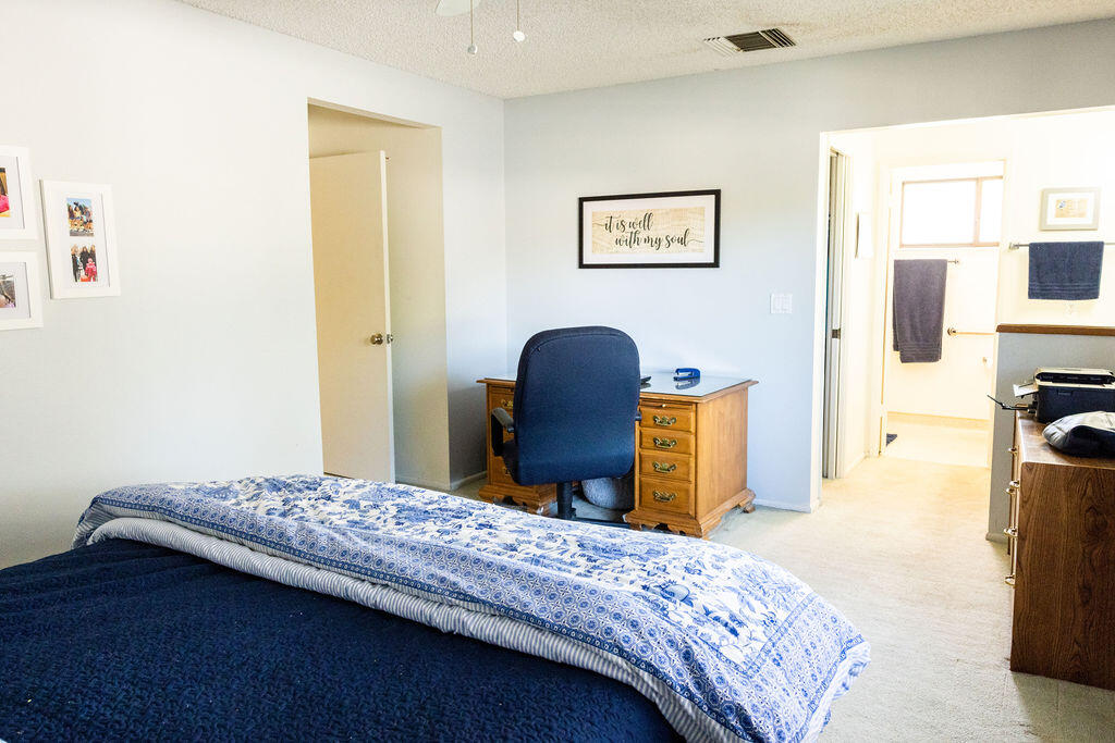 812 West Vicki Avenue Ridgecrest, CA 93555 - Photo 23 of 68 a bedroom with a bed and a dresser