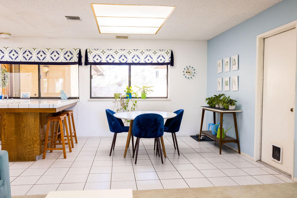 812 West Vicki Avenue Ridgecrest, CA 93555 - Photo 53 of 68 a dining room with furniture and a floor to ceiling window