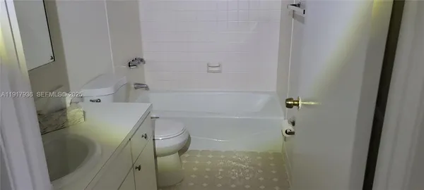 a bathroom with a sink and toilet