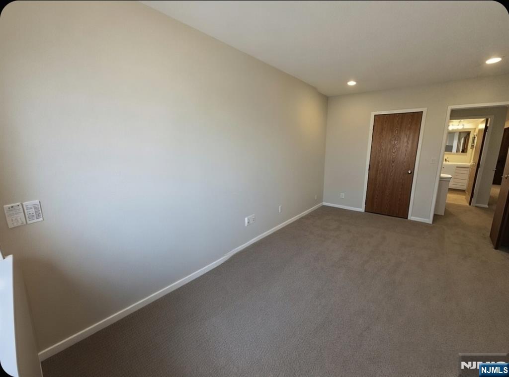 50 Euclid Avenue, Unit 3B Hackensack, NJ 07601 - Photo 10 of 16 an empty room with closet and mirror