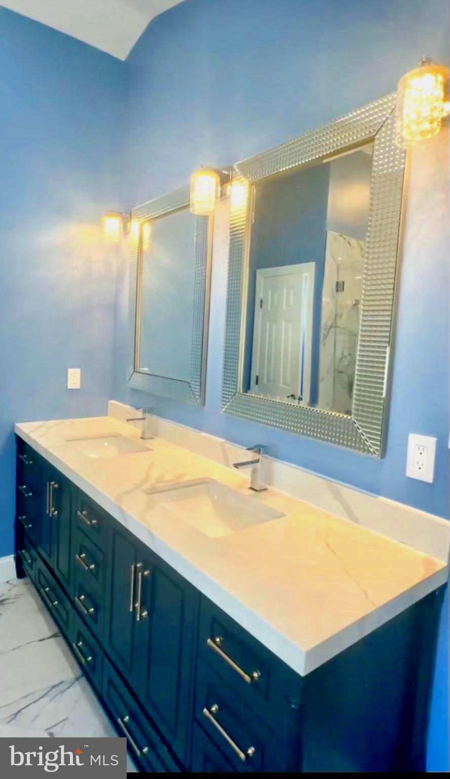 11546 Waesche Drive Bowie, MD 20721 - Photo 16 of 21 a bathroom with a sink and a mirror