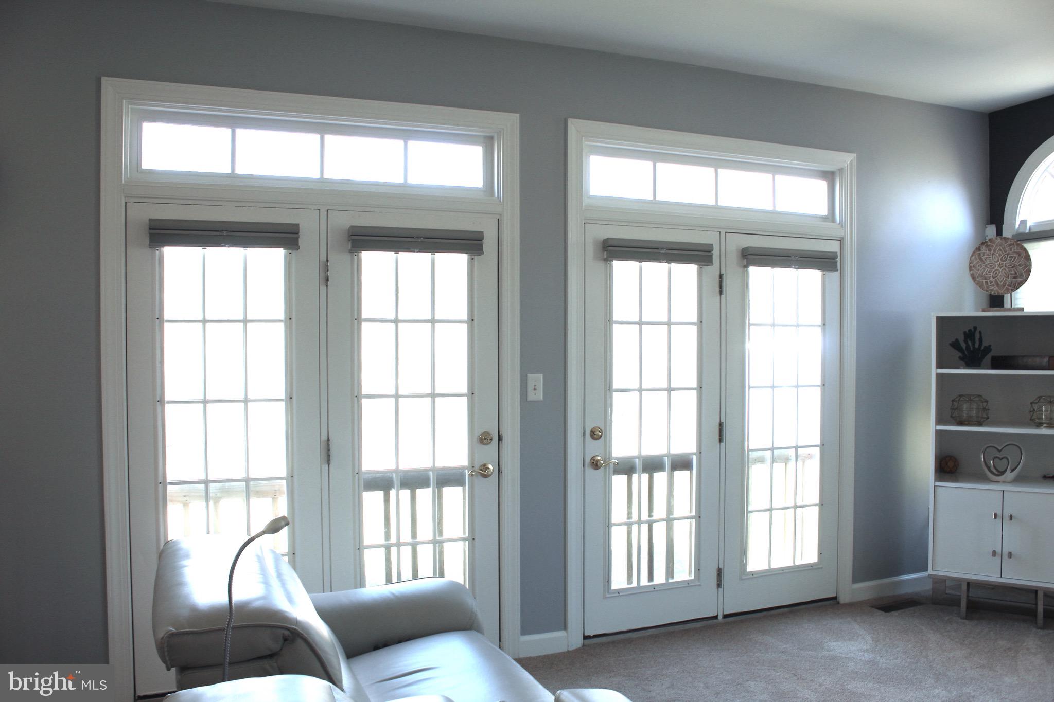 11546 Waesche Drive Bowie, MD 20721 - Photo 10 of 21 a living room with furniture and floor to ceiling windows