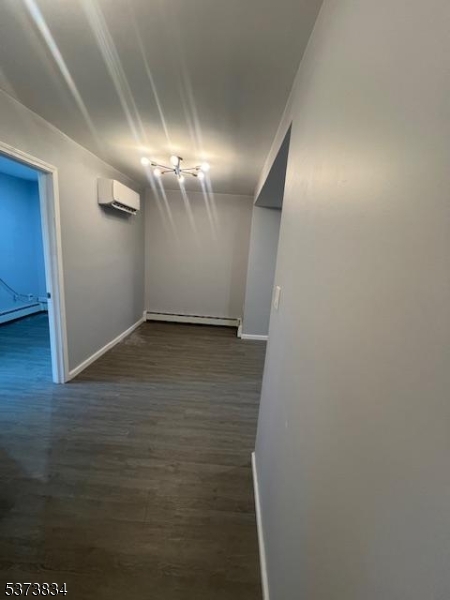 21 Alva Street Bloomfield, NJ 07003 - Photo 8 of 14 a view of a room with wooden floor