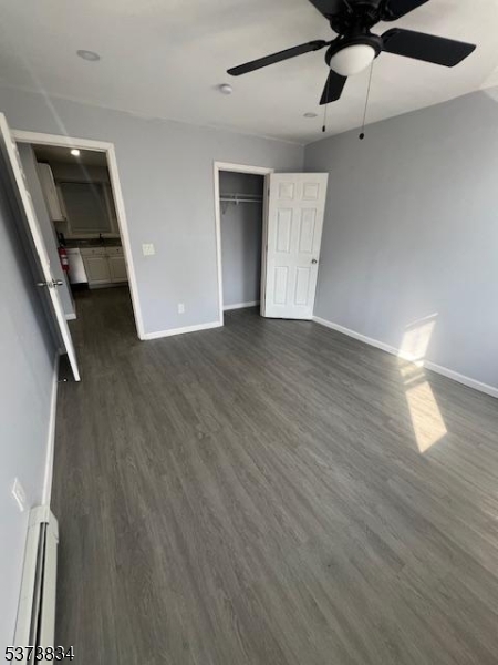 21 Alva Street Bloomfield, NJ 07003 - Photo 10 of 14 wooden floor in an empty room with a window