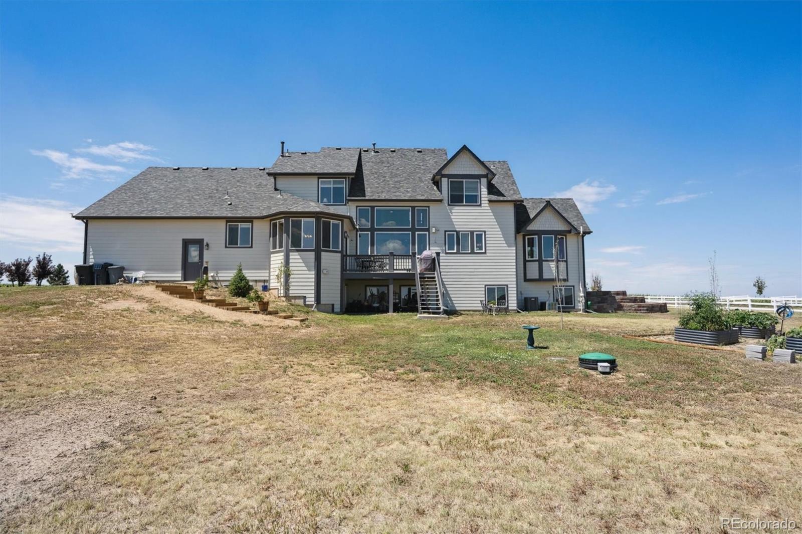 724 Imboden Road Watkins, CO 80137 - Photo 37 of 50 a front view of a house with a yard