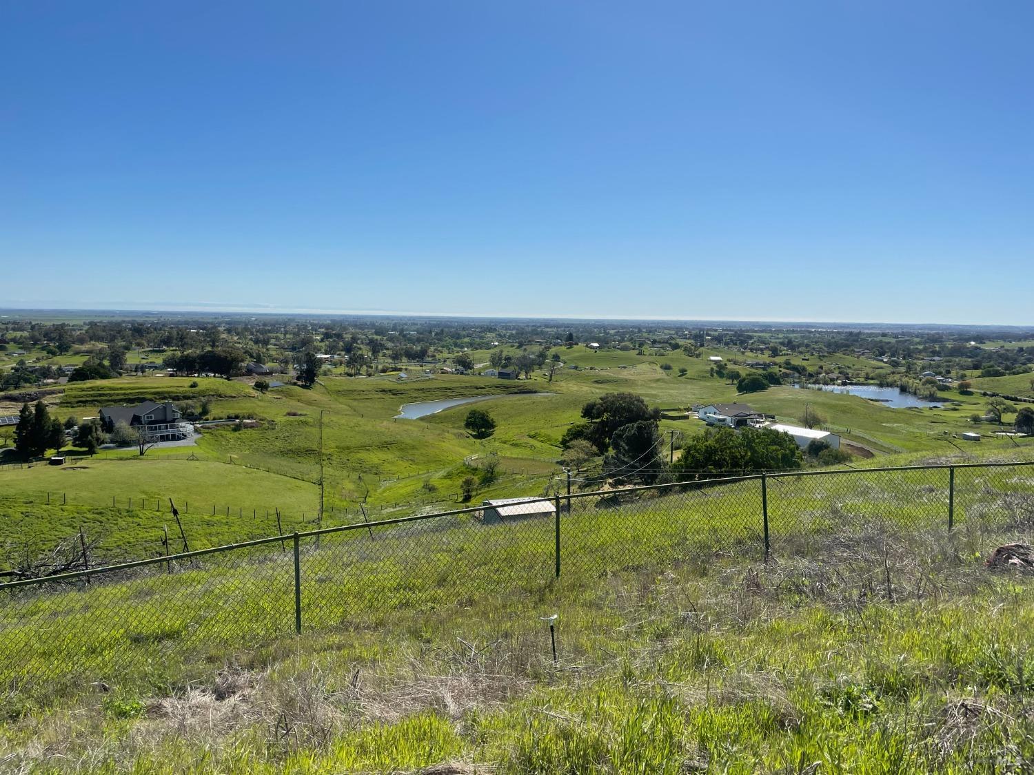 an aerial view of a golf course with parking space