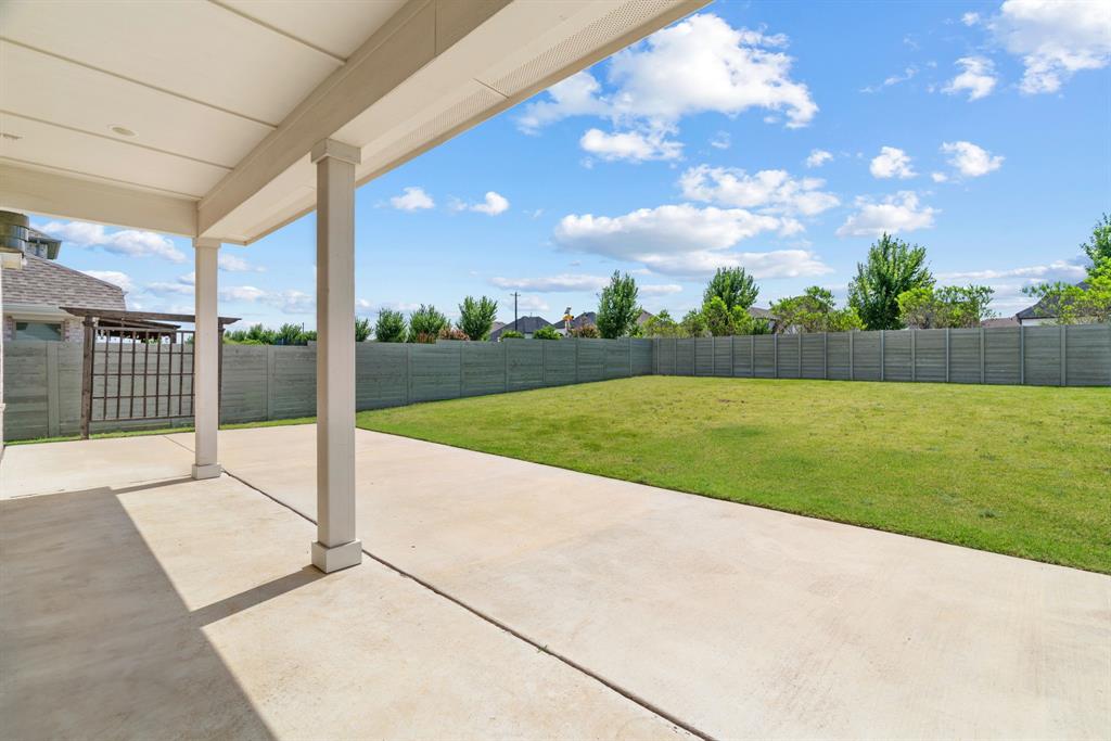 1821 Stonewall Road Argyle, TX 76226 - Photo 31 of 40 Expansive concrete patio with a covered porch structure, featuring recessed lighting