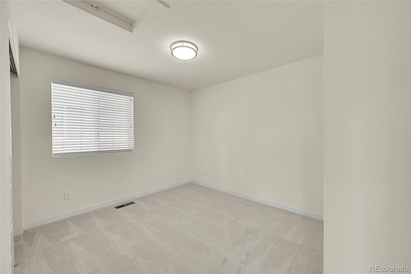 10951 Touchstone Loop Parker, CO 80134 - Photo 25 of 46 an empty room with a window