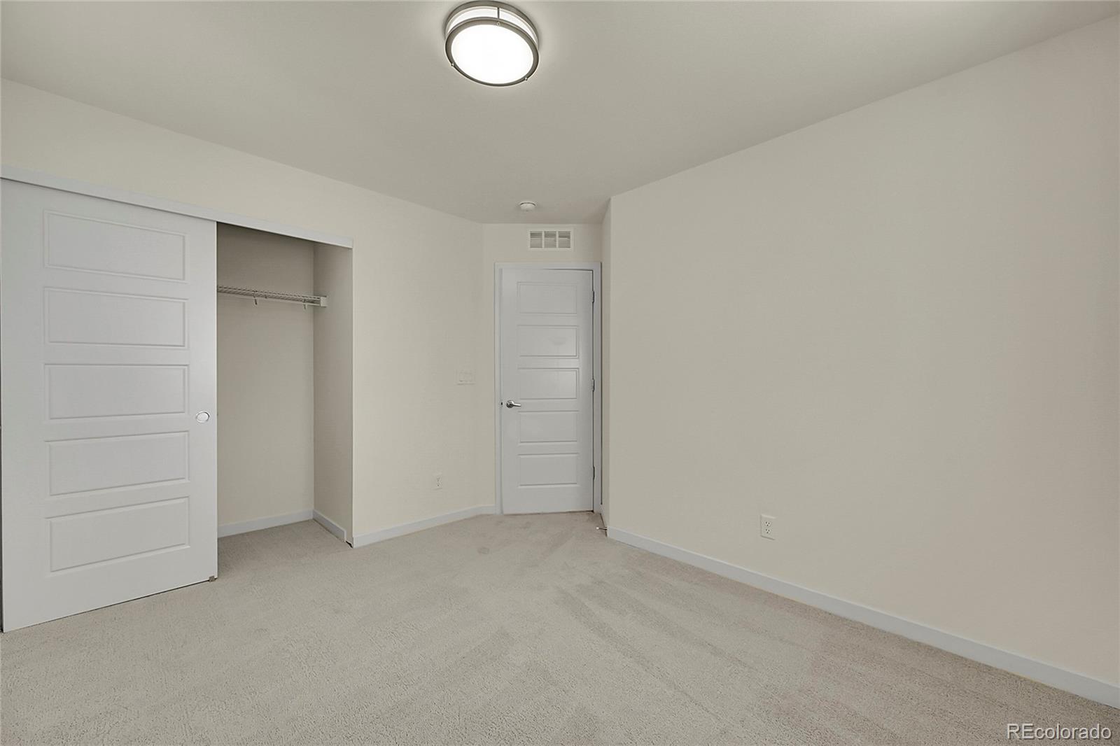 10951 Touchstone Loop Parker, CO 80134 - Photo 27 of 46 an empty room with closet
