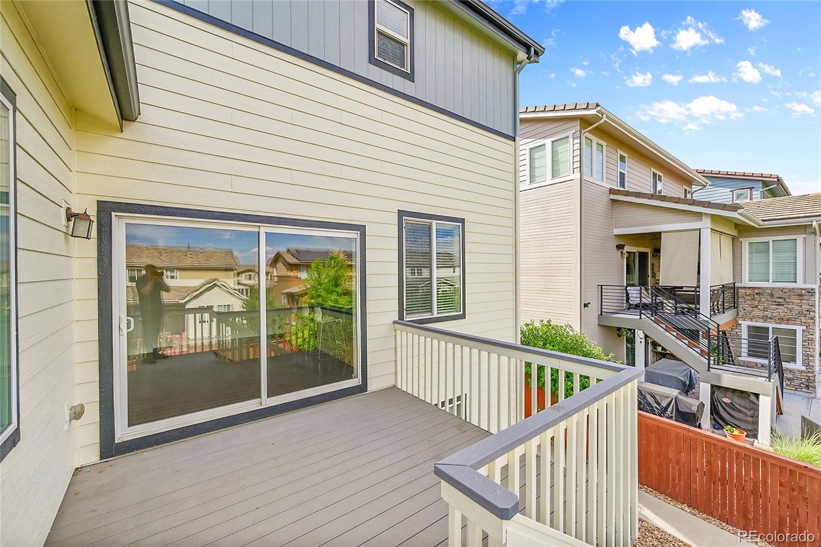 10951 Touchstone Loop Parker, CO 80134 - Photo 35 of 46 a view of a house with wooden deck
