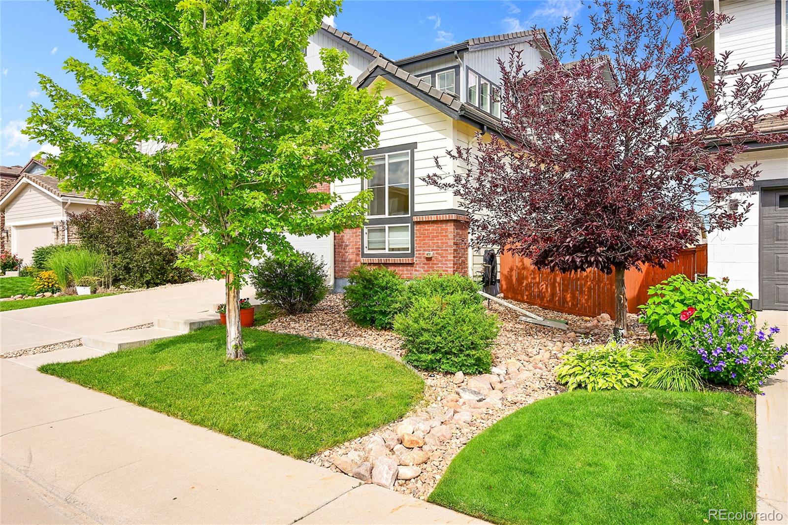 10951 Touchstone Loop Parker, CO 80134 - Photo 39 of 46 a front view of a house with a yard
