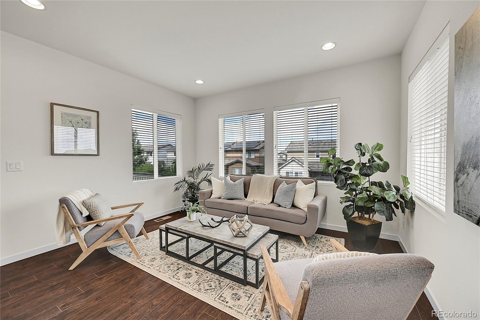 10951 Touchstone Loop Parker, CO 80134 - Photo 6 of 46 a living room with furniture potted plant and a window