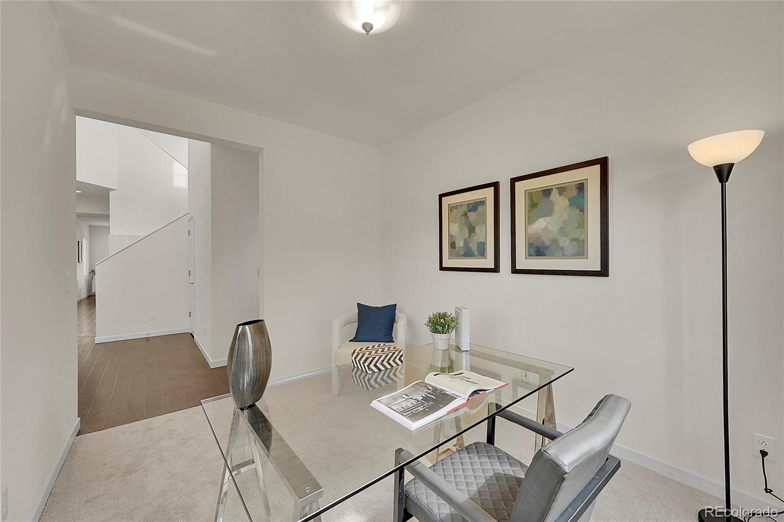 10951 Touchstone Loop Parker, CO 80134 - Photo 8 of 46 a view of a dining room with furniture