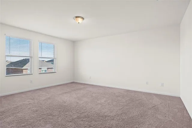 an empty room with a empty space and window