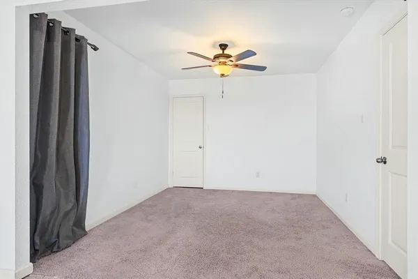 a view of a chandelier fan in a room
