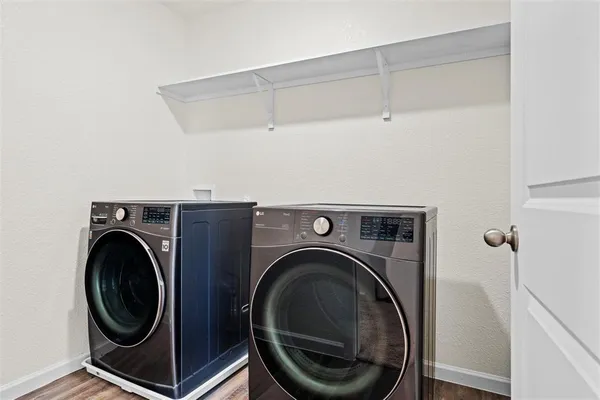 a utility room with dryer and washer