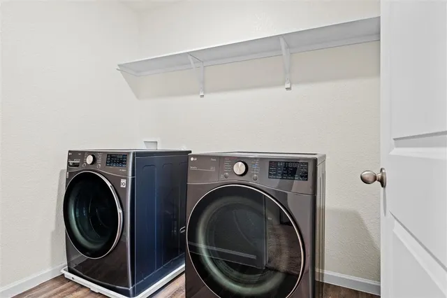 a utility room with dryer and washer