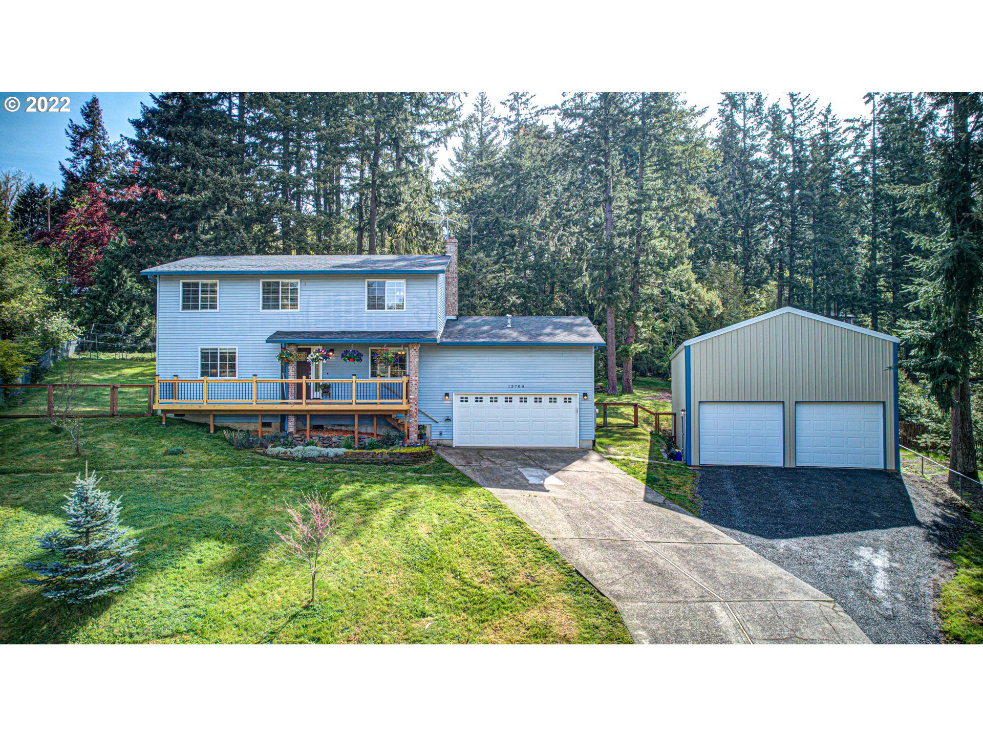 13780 Southeast Rust Way Damascus, OR 97089 - Photo 1 of 28 a house view with a garden space