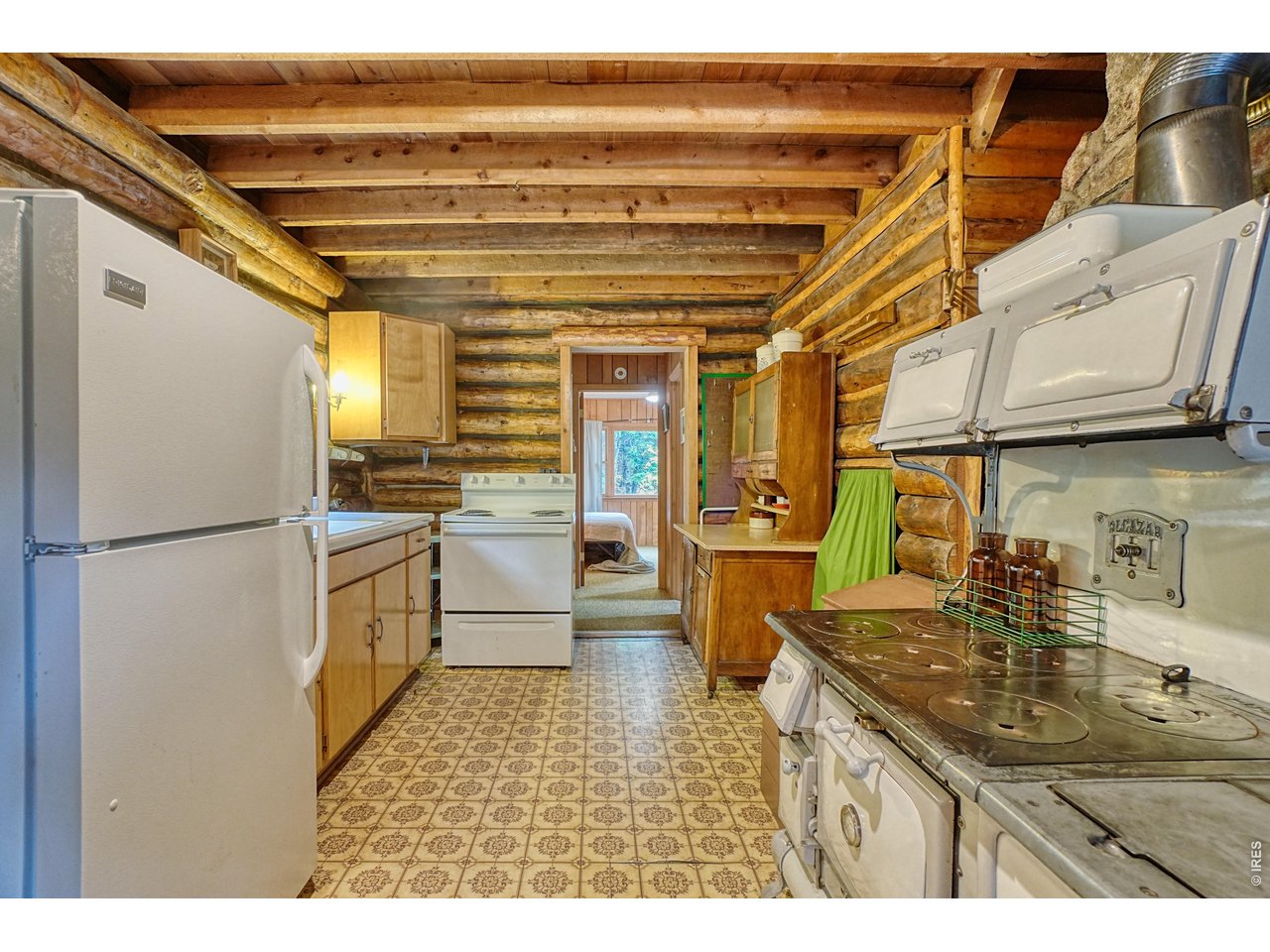3356 Riverside Drive Lyons, CO 80540 - Photo 17 of 28 Refrigerator, stove and oven included as well as functional Alcazar wood stove