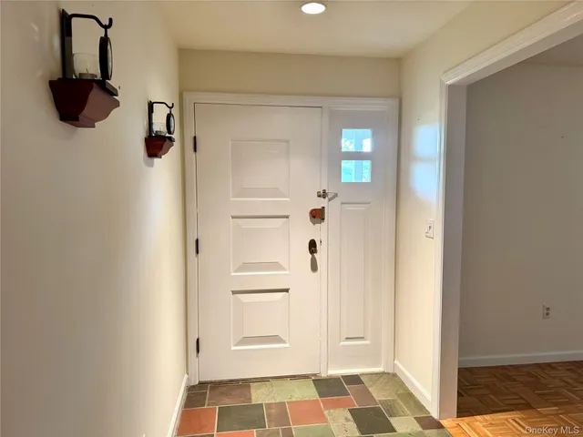 a view of bathroom with a shower and mirror