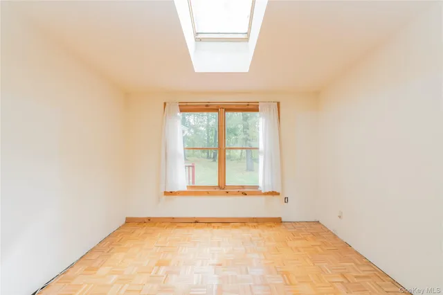 a view of an empty room with a window