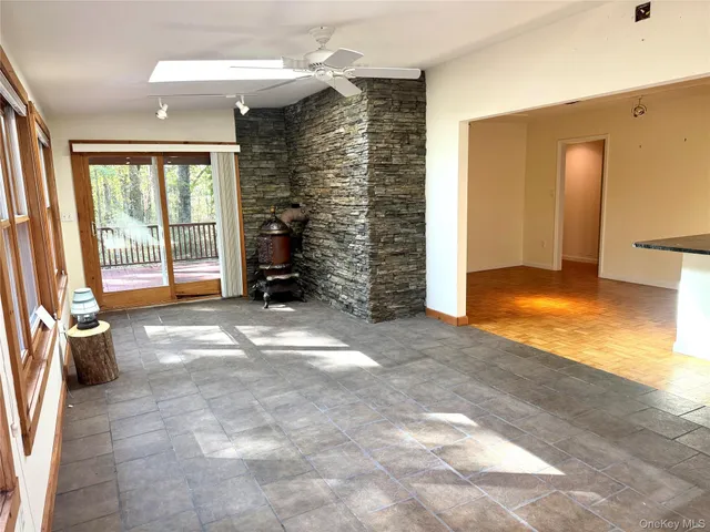 a view of an empty room with a fireplace