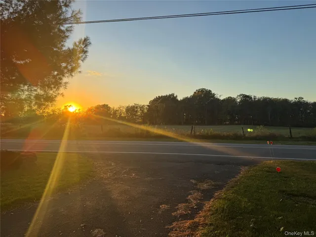 a view of an ocean and a yard