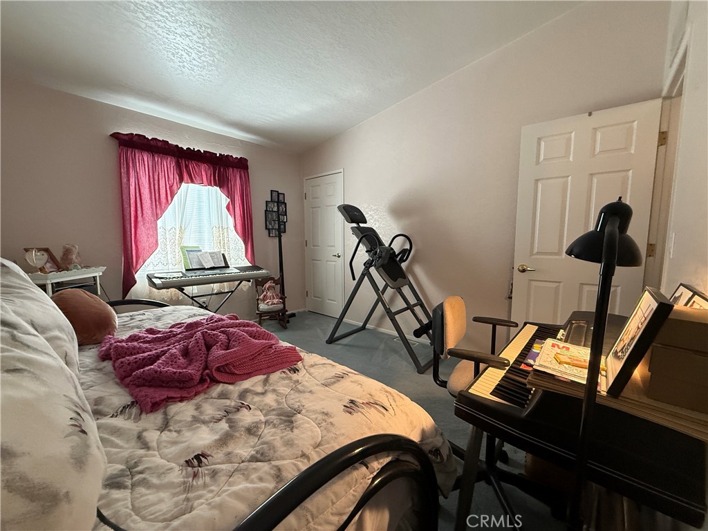 1550 Rory Lane Simi Valley, CA 93063 - Photo 11 of 18 a room with furniture and a flat screen tv
