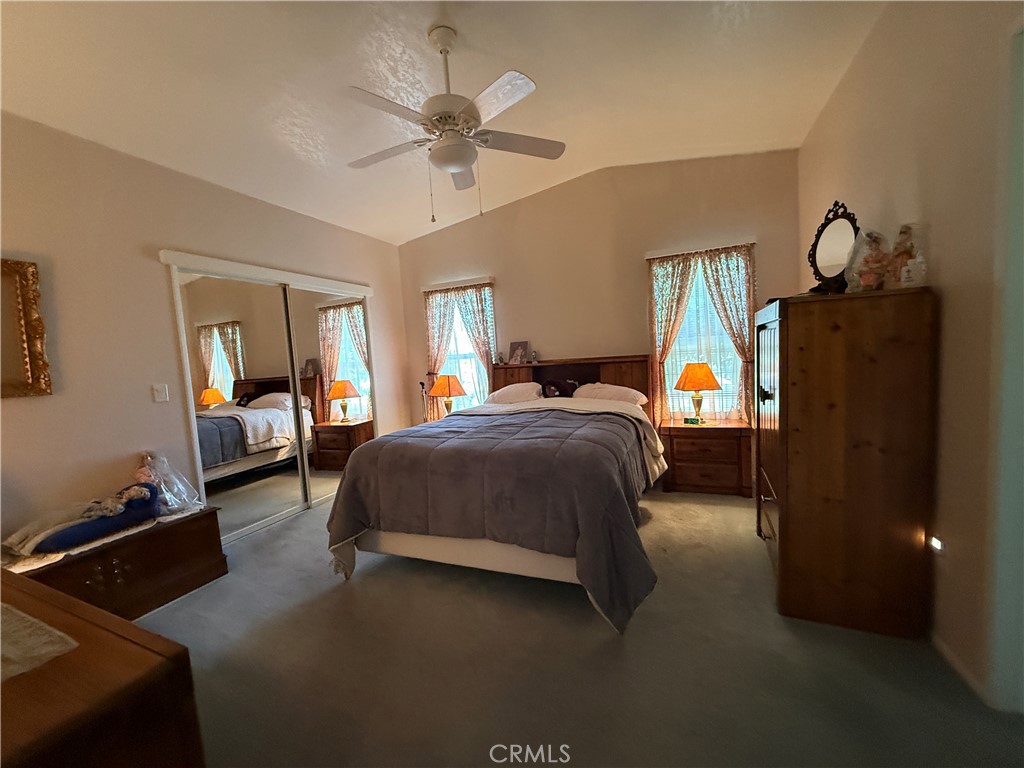 1550 Rory Lane Simi Valley, CA 93063 - Photo 12 of 18 a bed room with a bed and a chandelier