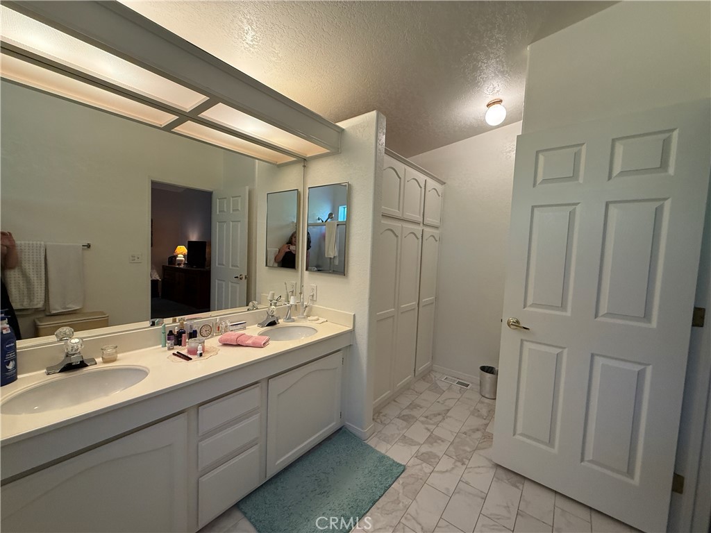 1550 Rory Lane Simi Valley, CA 93063 - Photo 15 of 18 a bathroom with a double vanity sink mirror and shower