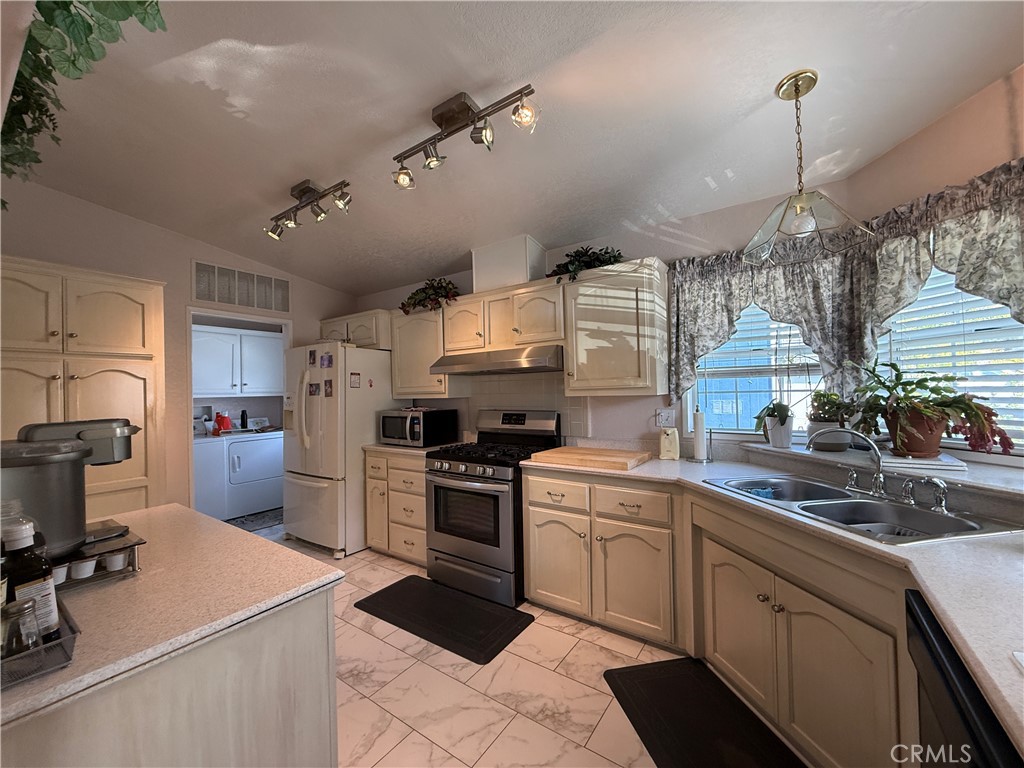 1550 Rory Lane Simi Valley, CA 93063 - Photo 3 of 18 a kitchen with a sink a stove and cabinets