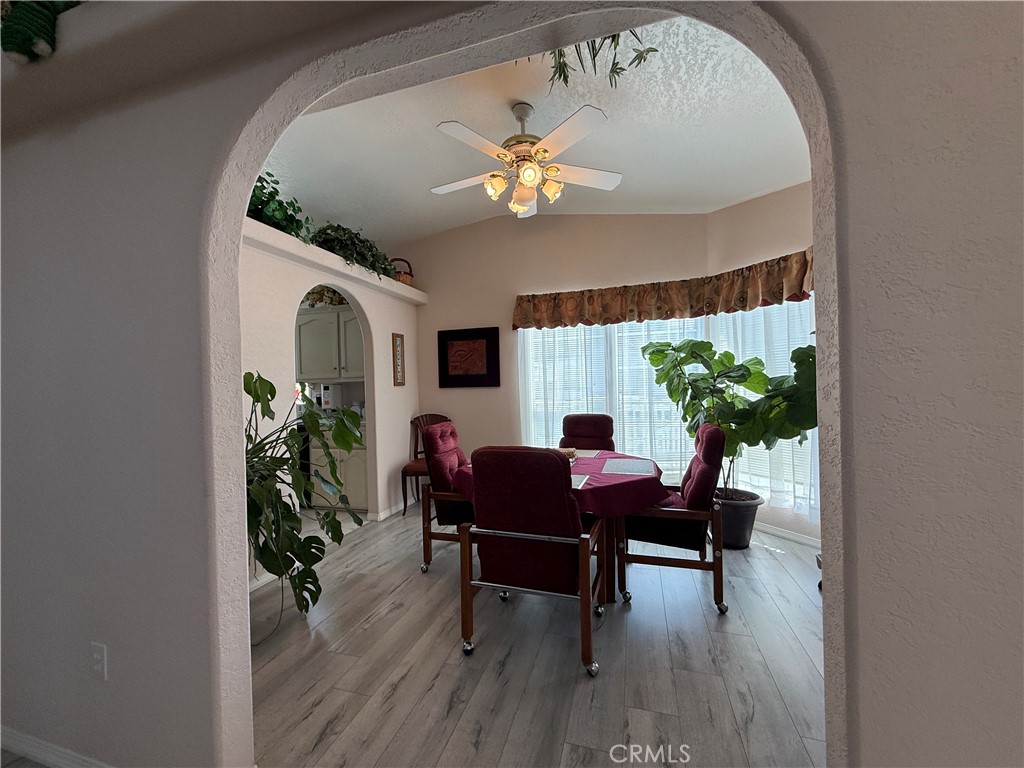 1550 Rory Lane Simi Valley, CA 93063 - Photo 6 of 18 a dining room with furniture potted plants and wooden floor