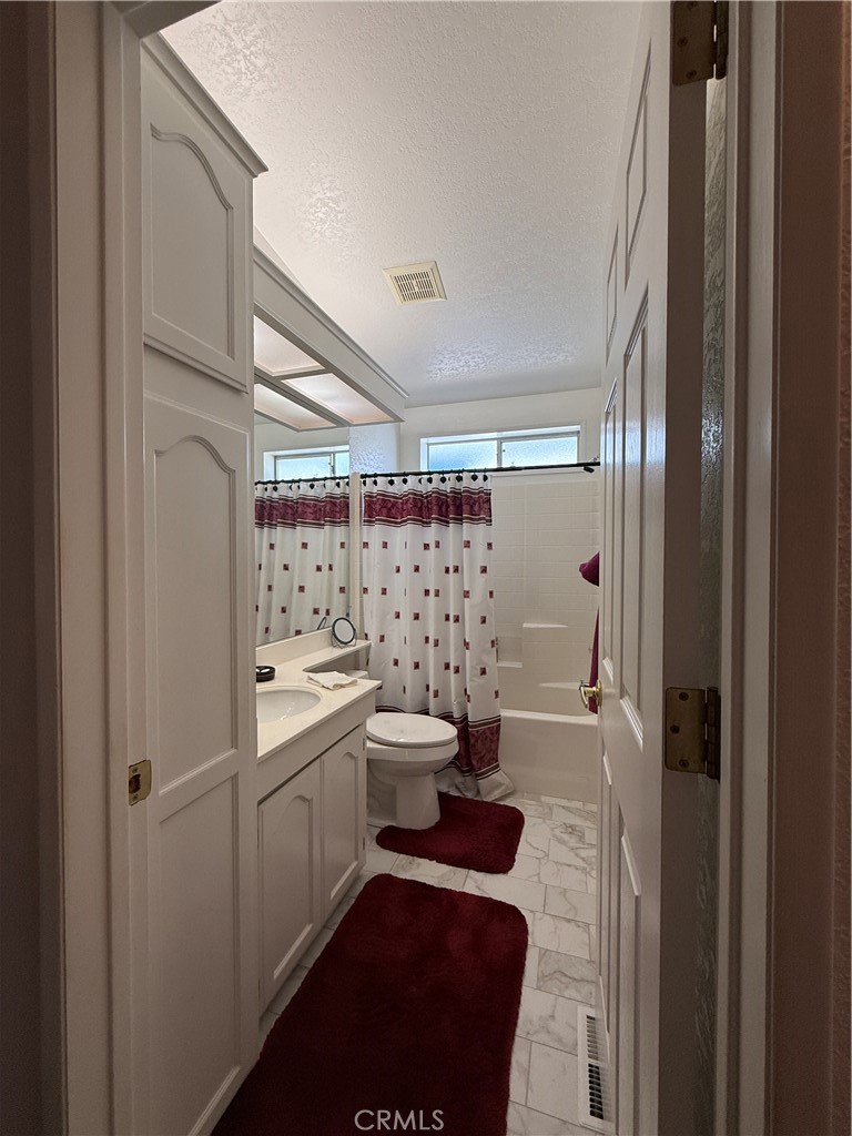 1550 Rory Lane Simi Valley, CA 93063 - Photo 9 of 18 a bathroom with a sink a toilet and shower