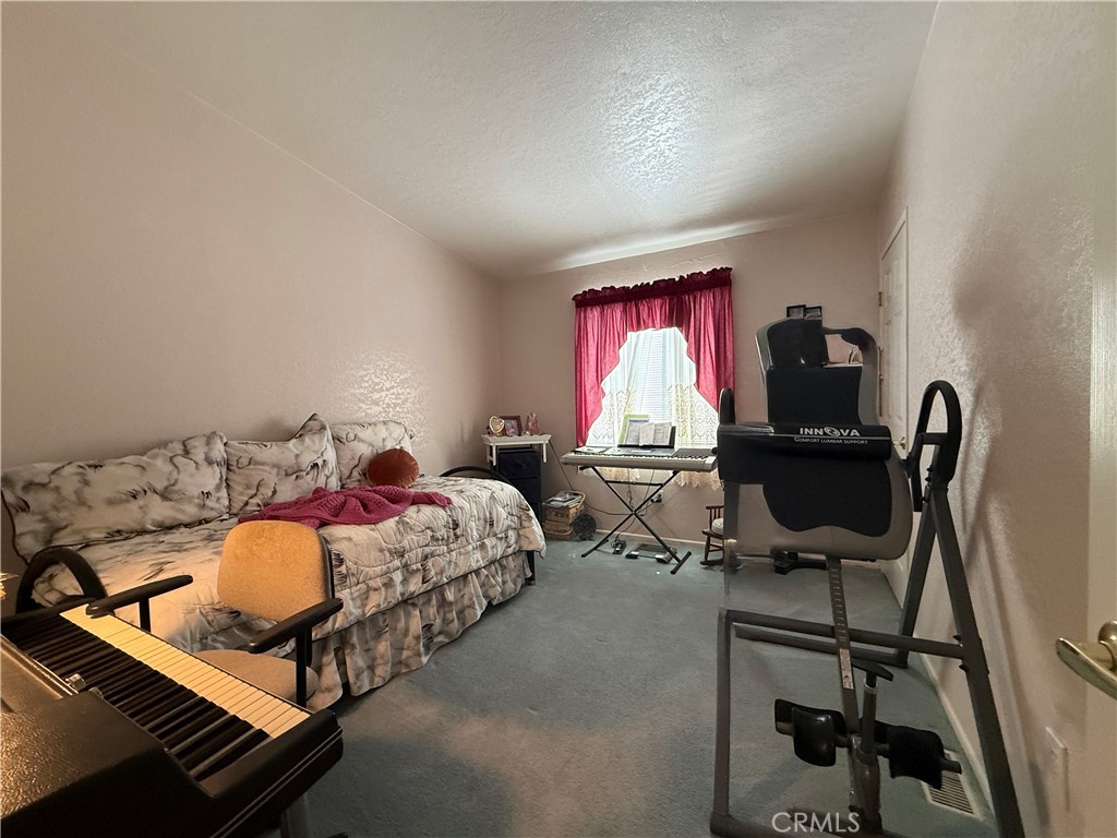 1550 Rory Lane Simi Valley, CA 93063 - Photo 10 of 18 a bedroom with a bed and a window