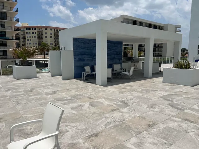 a room with pool table and chairs