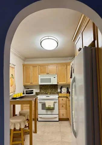 a bathroom with a sink vanity mirror and toilet