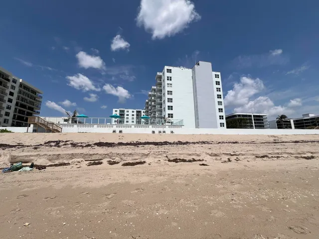 a view of a street with cars