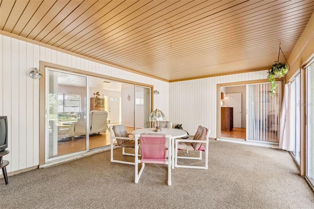 2059 Waterfall Drive Spring Hill, FL 34608 - Photo 20 of 26 a dining room with furniture and a floor to ceiling window