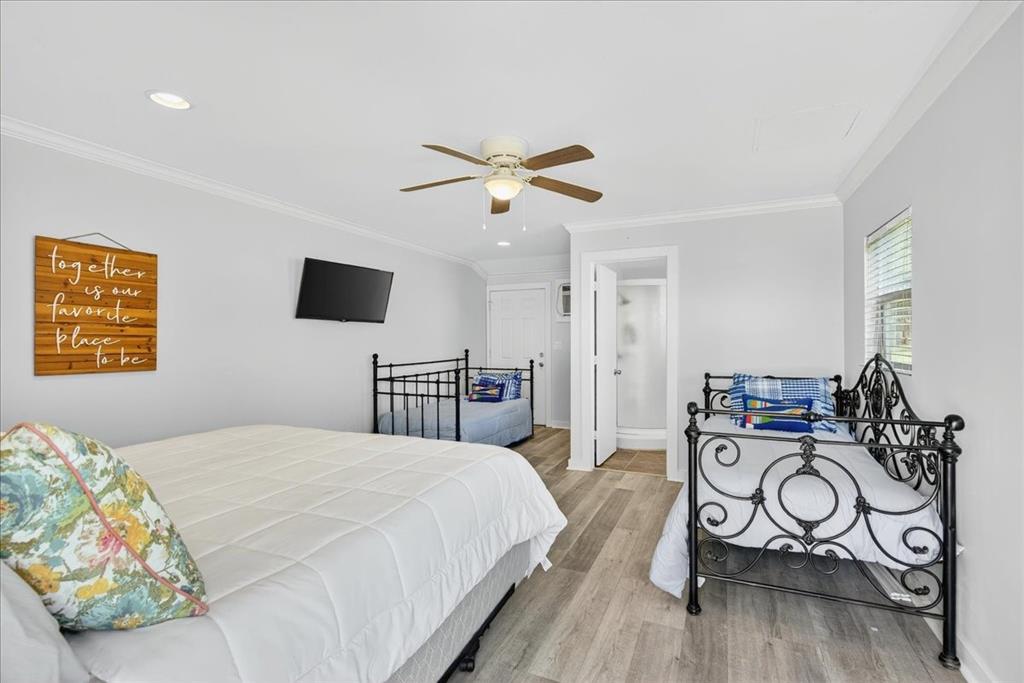 114 Baker B Ranch Road Trinidad, TX 75163 - Photo 18 of 32 a bedroom with a bed and a table in it