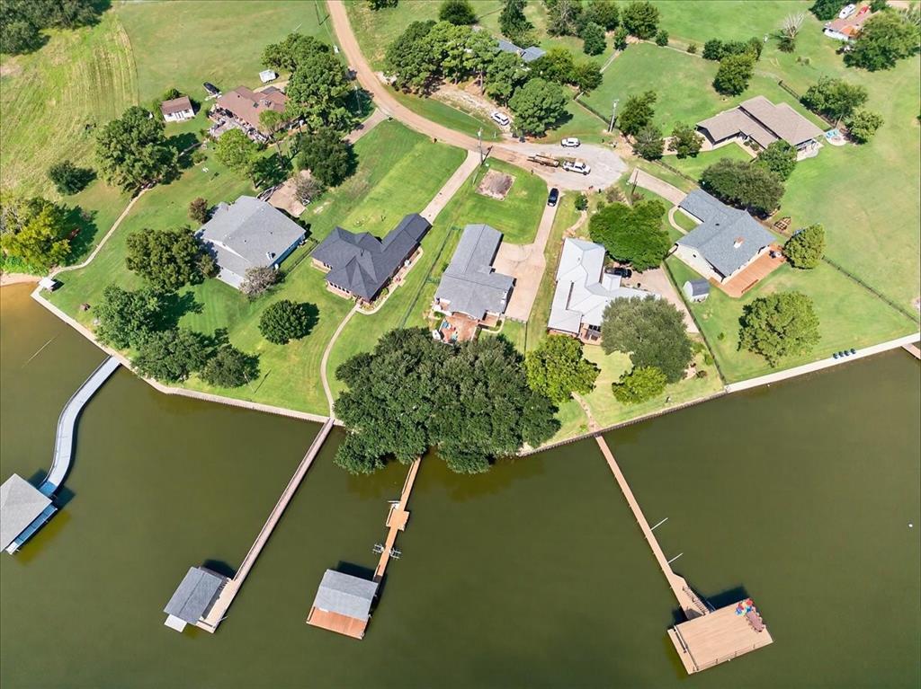 114 Baker B Ranch Road Trinidad, TX 75163 - Photo 2 of 32 an aerial view of a residential houses with yard
