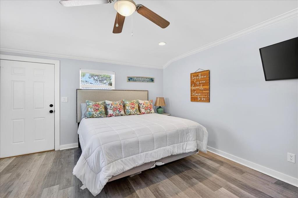 114 Baker B Ranch Road Trinidad, TX 75163 - Photo 21 of 32 a bedroom with a bed and a flat screen tv