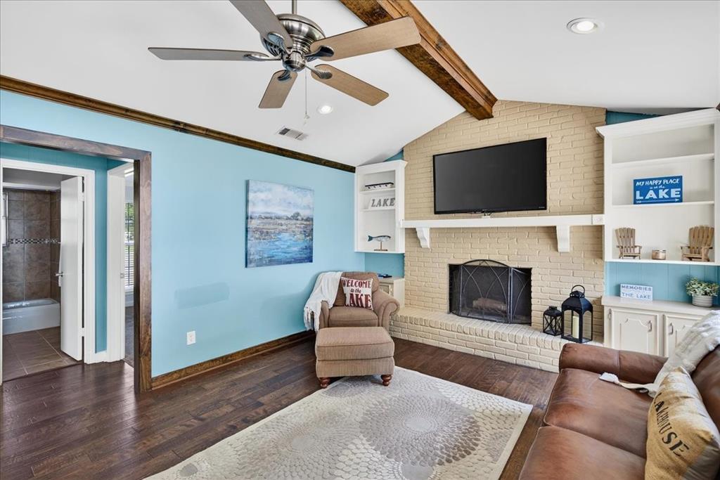 114 Baker B Ranch Road Trinidad, TX 75163 - Photo 4 of 32 a living room with furniture a flat screen tv and a fireplace