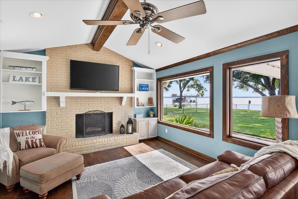 114 Baker B Ranch Road Trinidad, TX 75163 - Photo 5 of 32 a living room with furniture a flat screen tv and a fireplace