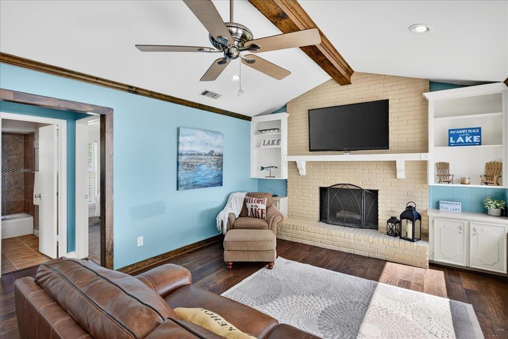 114 Baker B Ranch Road Trinidad, TX 75163 - Photo 6 of 32 a bedroom with a bed a couch and a flat screen tv