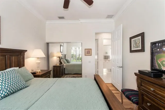 a bedroom with furniture and a flat screen tv