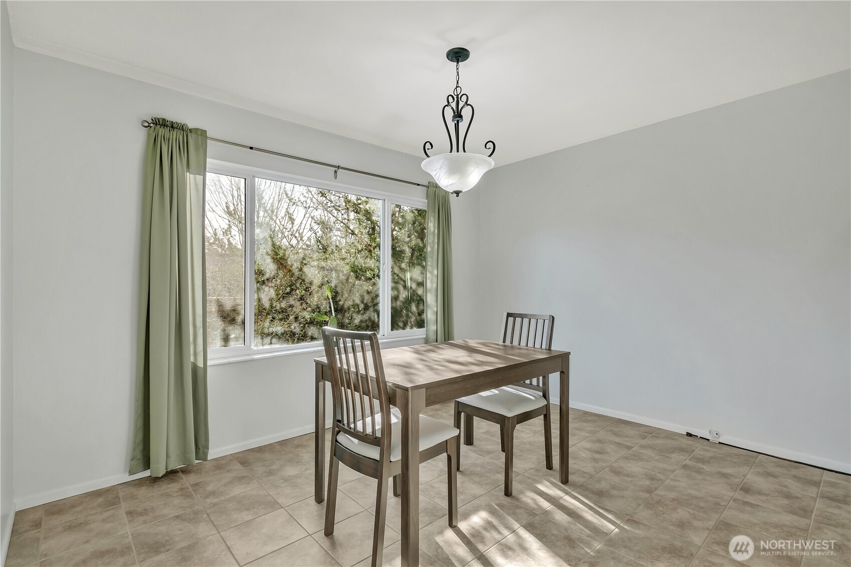 4545 Sand Point Way Northeast, Unit 207 Seattle, WA 98105 - Photo 11 of 25 a view of a dining room with furniture window and outside view