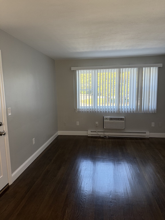 15 Washington Street, Unit 9 Plainville, MA 02762 - Photo 1 of 11 an empty room with wooden floor and windows
