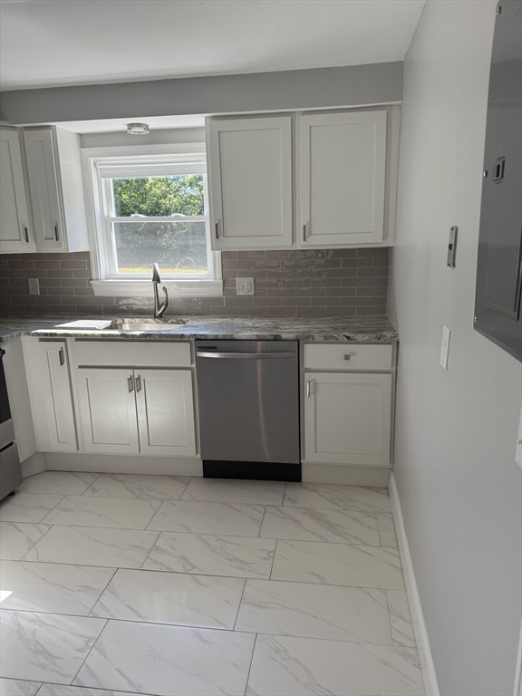 15 Washington Street, Unit 9 Plainville, MA 02762 - Photo 6 of 11 a kitchen with a stove sink and cabinets